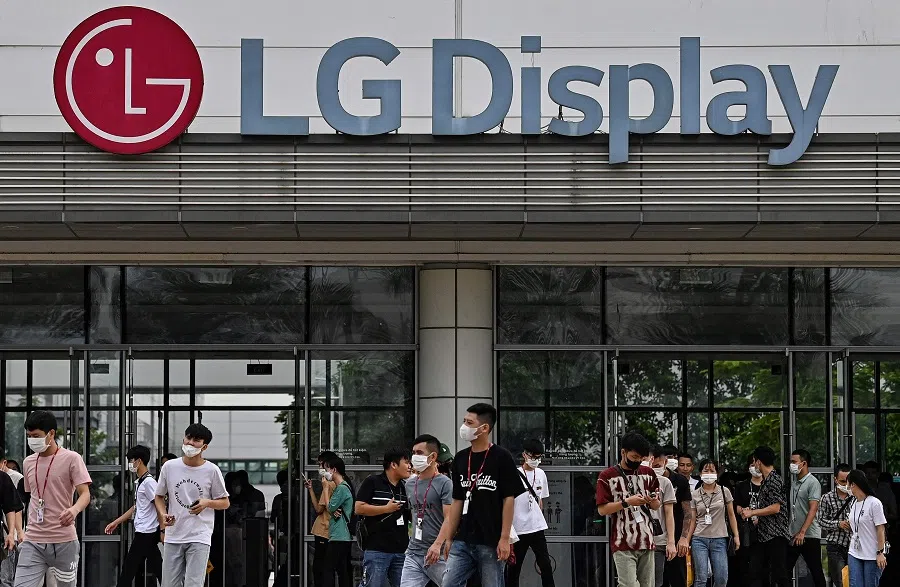 This picture taken on 29 August 2023 shows employees leaving the LG Display factory in Hai Phong, Vietnam. (Nhac Nguyen/AFP)