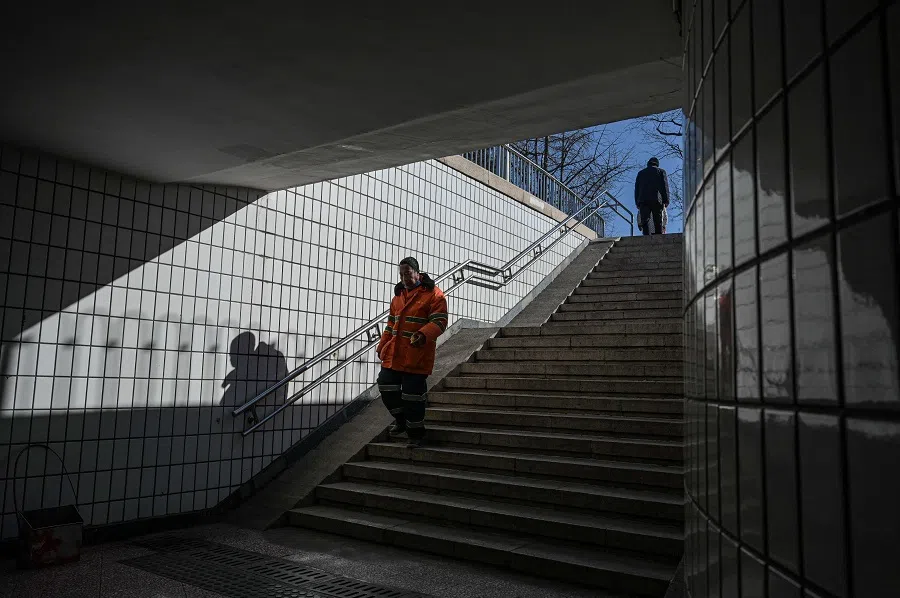 People walk in a pedestrian underpass in Beijing, China, on 9 January 2025. (Jade Gao/AFP)