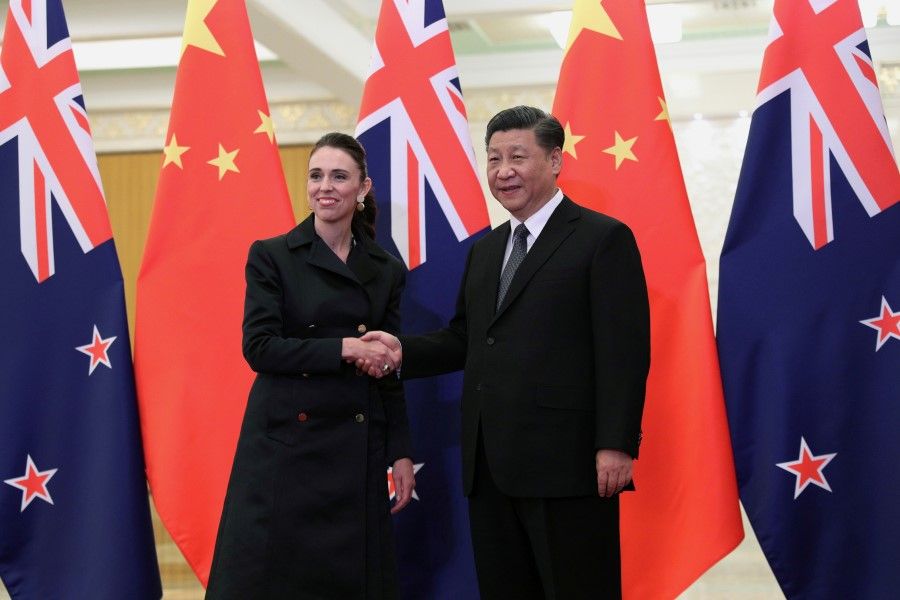 Chinese President Xi Jinping and New Zealand Prime Minister Jacinda Ardern shake hands before the meeting at the Great Hall of the People in Beijing, China on 1 April 2019. (Kenzaburo Fukuhara/Kyodo News/Pool via Reuters)