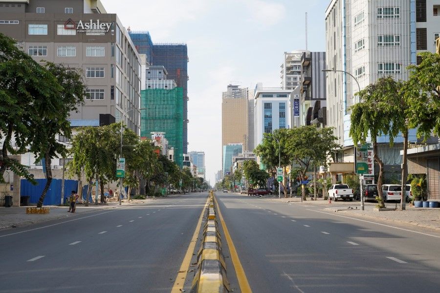 A view of an empty street during a 14-day citywide lockdown implemented amid a rising number of the coronavirus disease (COVID-19) cases, in Phnom Penh, Cambodia, 15 April 2021. (Cindy Liu/Reuters)