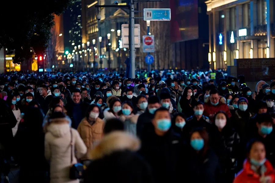 People gather to celebrate the arrival of the New Year near the Bund in Shanghai, China, 31 December 2020. (Aly Song/Reuters)
