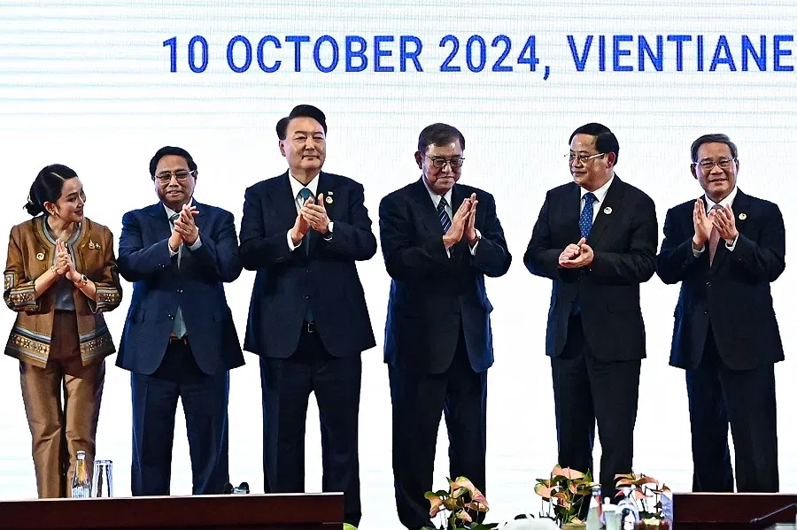 Chinese Premier Li Qiang (first from right) during a group photo at the 27th ASEAN Plus Three Summit in Vientiane on 10 October 2024. (Nhac Nguyen/AFP)