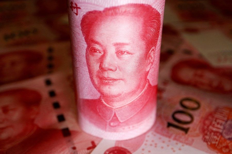 Chinese Yuan banknotes are seen in this illustration picture taken 14 June 2022. (Florence Lo/Reuters)