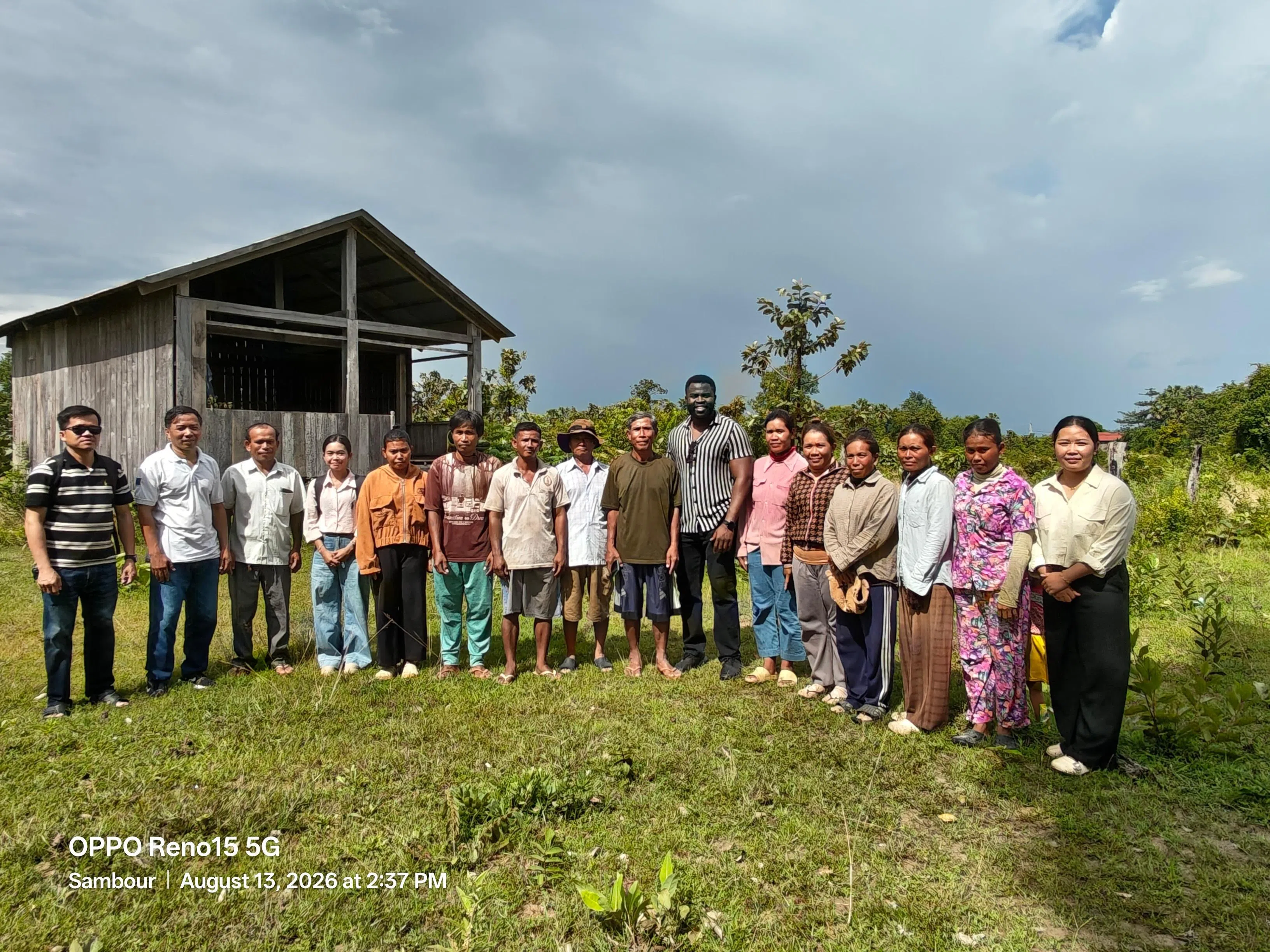 Field survey team with farmers and community members outside the village hall in Kratie province, Cambodia.