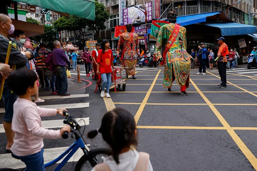 A view of the religious festival parade on the streets in New Taipei City, Taiwan, on 29 October 2023. (Ann Wang/Reuters)
