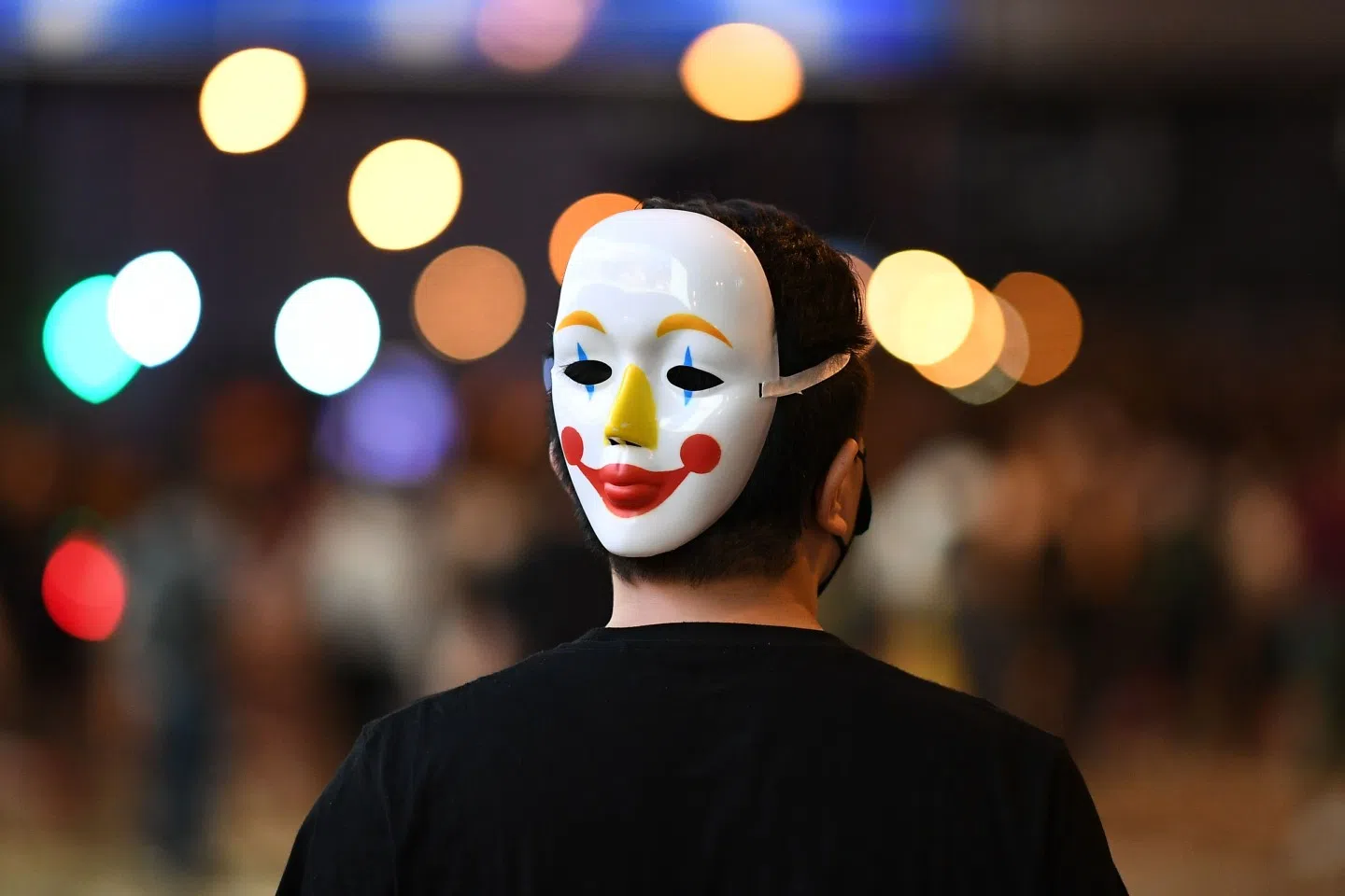 Already assembling unlawfully, why would anyone in the march feel jittery over breaking the anti-mask law? (Mohd Rasfan / AFP)