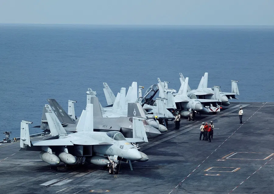Fighter jets on US Navy aircraft carrier USS George Washington are pictured during the Freedom Edge trilateral exercise among the US, Japan and South Korea in the East China Sea, south of the Korean peninsula and west of Japan’s main islands, 14 November 2024. (Kim Kyung-Hoon/Reuters)