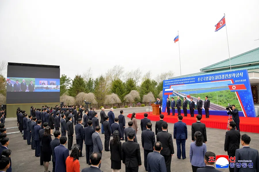 Officials attend a ground-breaking ceremony for a new road bridge spanning the Tumen River that will link North Korea to Russia in Rason Municipality, North Korea, 30 April 2025, in this photo released by North Korea’s official Korean Central News Agency. (KCNA via Reuters)
