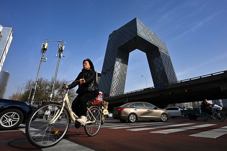 A cyclist cycling in the central business district of Beijing, China, on 9 December 2023. (SPH Media)