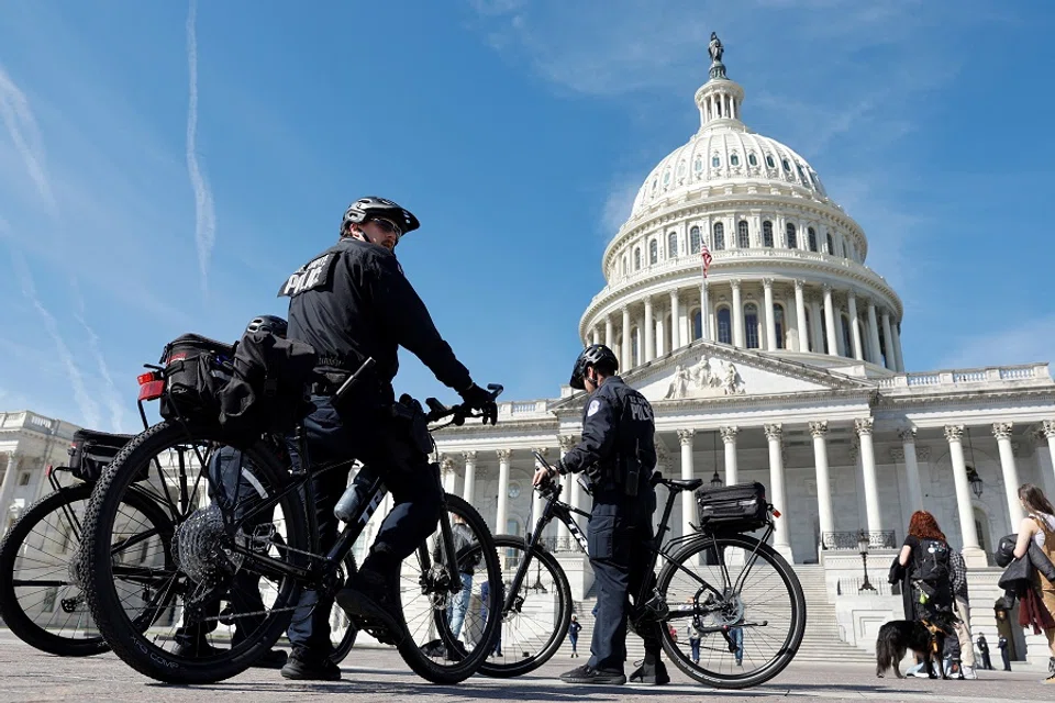 US Capitol Police officers patrol on bicycles at the US Capitol in Washington, US, 21 March 2023. (Jonathan Ernst/Reuters)