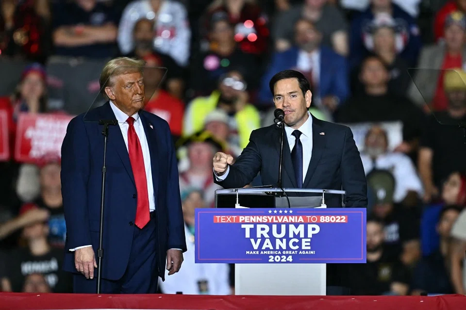 US senator Marco Rubio speaks next to US President-elect Donald Trump during a campaign rally at the PPL Center in Allentown, Pennsylvania, on 29 October 2024.  (Angela Weiss/AFP)