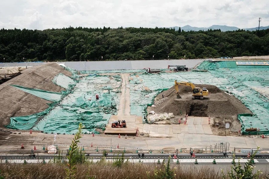 This photo taken on 2 August 2021 shows the constructed landfill surface soil contaminated with radiation, inside the exclusion zone where residents are allowed to enter for 30 days per year in Okuma, Fukushima, Japan. (Yasuyoshi Chiba/AFP)