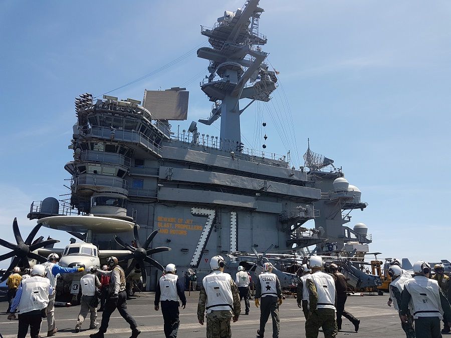 A busy day on the flight deck of the USS Theodore Roosevelt while transiting the South China Sea on 10 April 2018. (Karen Lema/File Photo/Reuters)