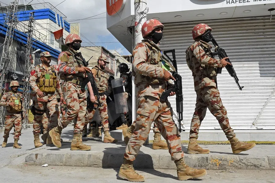 Security personnel patrol a street during a procession on the seventh day of the Islamic month of Muharram, commemorating the seventh-century killing of Prophet Muhammad's grandson Imam Hussein in Quetta, Balochistan province, Pakistan, on 26 July 2023. (Banaras Khan/AFP)