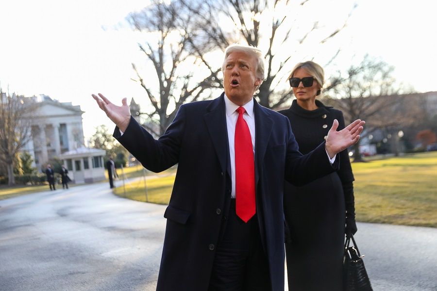 Former US President Donald Trump gestures as he and former first lady Melania Trump depart the White House to board Marine One ahead of the inauguration of current US President Joe Biden, in Washington, US, 20 January 2021. (Leah Millis/Reuters)
