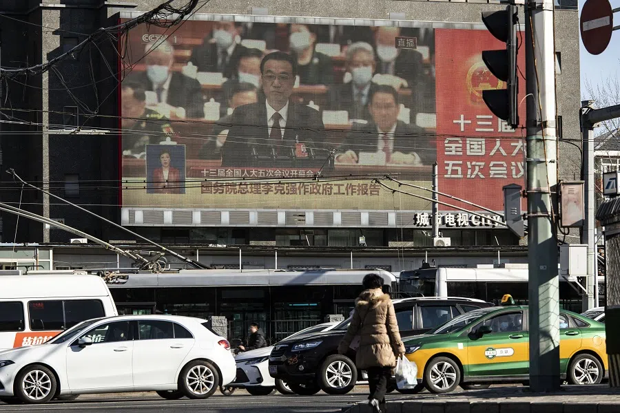 A screen displays a live news broadcast of Chinese Premier Li Keqiang speaking at the National People's Congress in Beijing, China, on 5 March 2022. (Qilai Shen/Bloomberg)