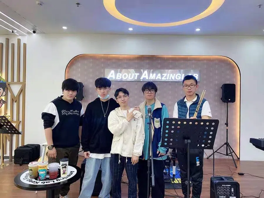 Ding Ching Hoi (first from left) with music lovers at his studio in Shenzhen, 19 May 2023. (SPH Media)