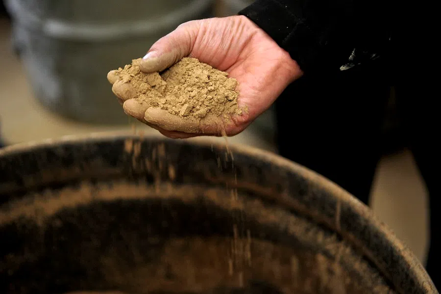 A handful of rocks containing rare earth elements at Mountain Pass, California, US, on 13 December 2010.  (Jacob Kepler/Bloomberg)
