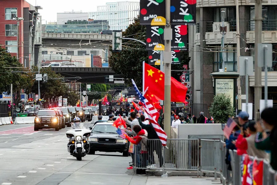 Supporters cheer as the motorcade of Chinese President Xi Jinping passes as he arrives at his hotel in San Francisco, California, US on 14 November 2023. (Jason Henry/AFP)