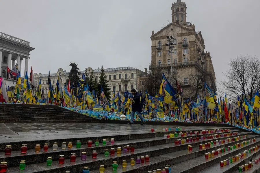 The man walks among displayed candles at the makeshift memorial for the Ukrainian and foreign fighters on the Independence Square in Kyiv, on 31 March 2025, amid the Russian invasion of Ukraine. (Tetiana Dzhafarova/AFP)