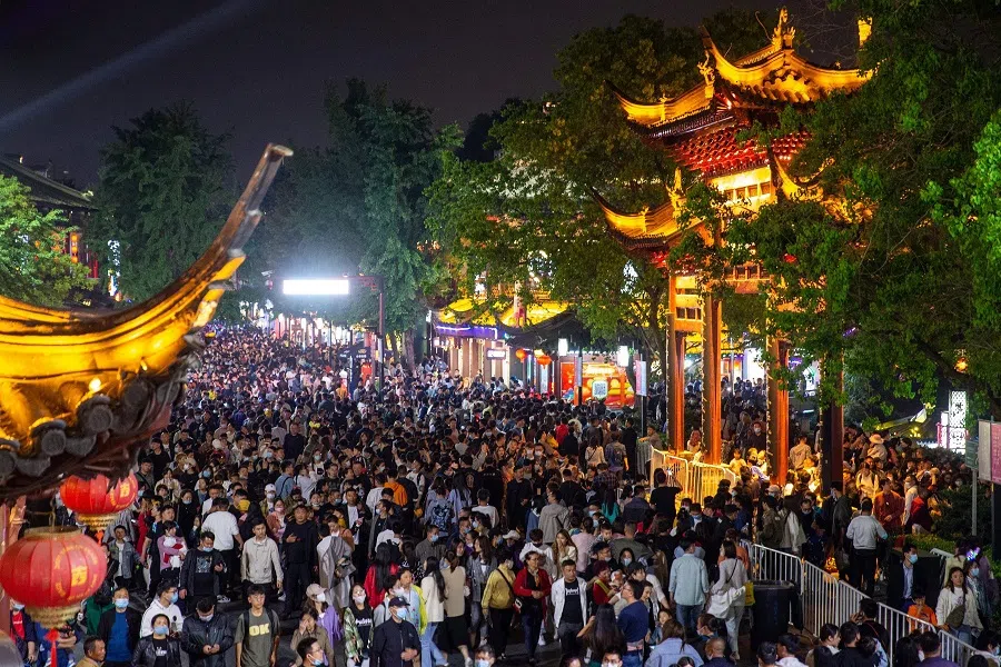 This photo taken on 4 May 2021 shows people visiting Fuzimiao, also called Confucian Temple, in Nanjing, Jiangsu province, China. (STR/AFP)