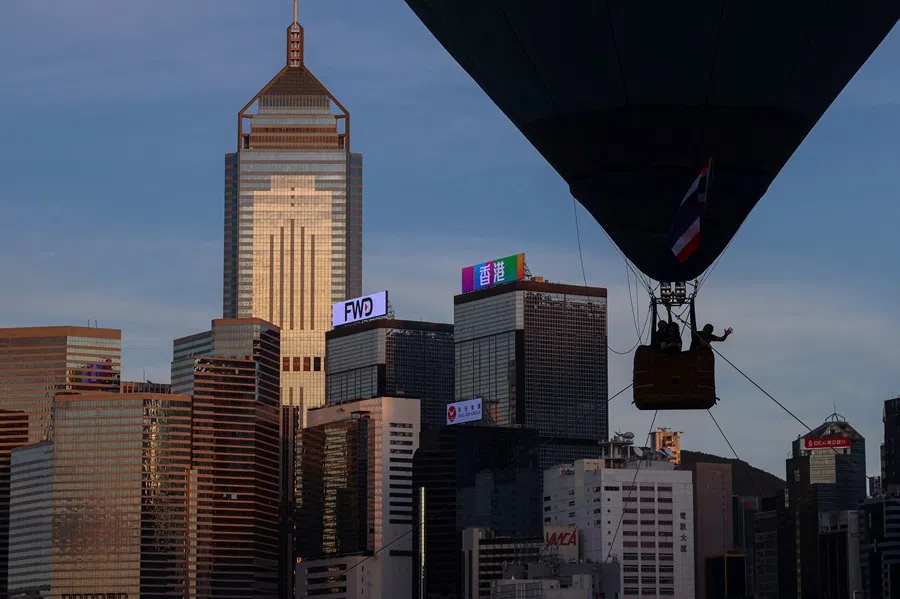 Staff conduct tests in a tethered hot air balloon during the AIA International Hot Air Balloon Fest, at the Central Harbourfront Event Space with the skyline in the background, in Hong Kong, China, 4 September 2025. (Tyrone Siu/Reuters)