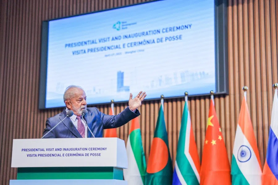 Brazil's President Luiz Inacio Lula da Silva gestures as he speaks during the inauguration of the president of the New Development Bank, Dilma Rousseff in Shanghai, China, 13 April 2023. (Ricardo Stuckert/Handout via Reuters)
