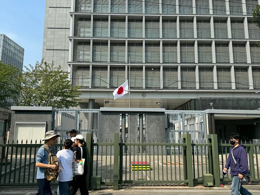 The Japanese flag flies at half mast at the Japanese embassy in Beijing, China on 19 September 2024.