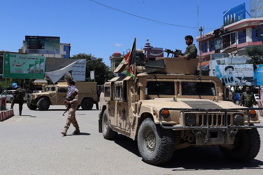 Afghan security forces sit in a Humvee vehicle amid ongoing fighting between Taliban militants and Afghan security forces in Kunduz on 19 May 2020. (STR/AFP)