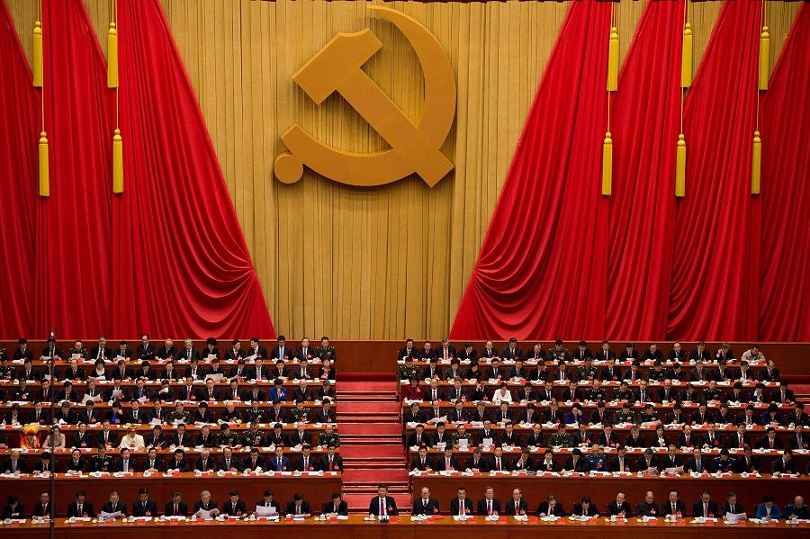 In this file photo taken on 24 October 2017, a general view shows delegates, including China's President Xi Jinping (centre), attending the closing of the 19th Communist Party Congress at the Great Hall of the People in Beijing, China. (Nicolas Asfouri/AFP)
