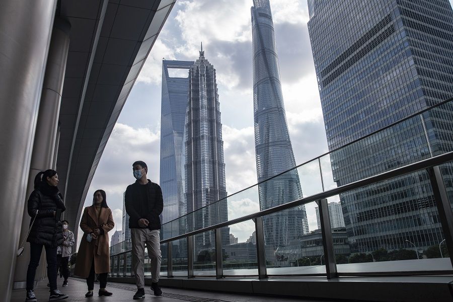 Pedestrians walk through the Lujiazui financial district in Shanghai, China, on 1 December 2020. (Qilai Shen/Bloomberg)