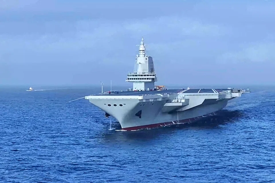 This screen grab from video footage from China’s Ministry of Defence taken in May 2024 and released via AFPTV on 11 May 2024 shows China’s third aircraft carrier Fujian carrying out sea trials at sea in an unknown location. (China’s Ministry of Defence/Handout via AFP)