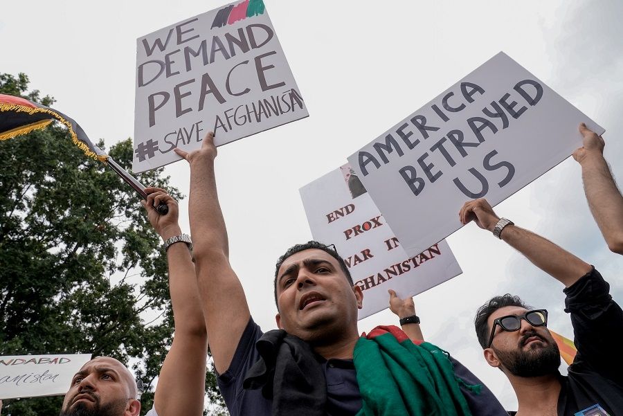 People crowd together in support of Afghanistan and against the Taliban, in front of the White House in Washington, US, 15 August 2021, on the day Taliban insurgents entered Afghanistan's capital Kabul. (Ken Cedeno/Reuters)