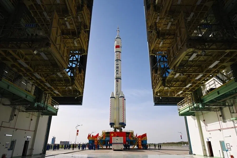 The Shenzhou-23 manned spacecraft and Long March-2F Y23 launch vehicle assembly is transported to the launch area at the Jiuquan Satellite Launch Center in the Gobi desert, in northwest China on 16 May 2026.
