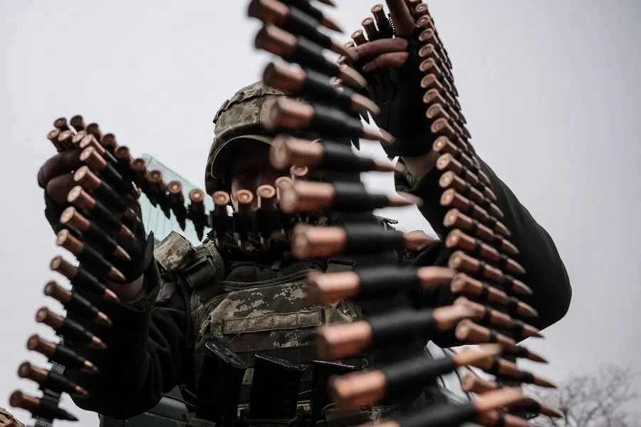 A Ukrainian serviceman of 24th mechanised brigade named after King Danylo loads cartridges to a machine gun strip during an exercise, amid Russia’s attack on Ukraine, in Donetsk region, Ukraine, on 29 November 2024.