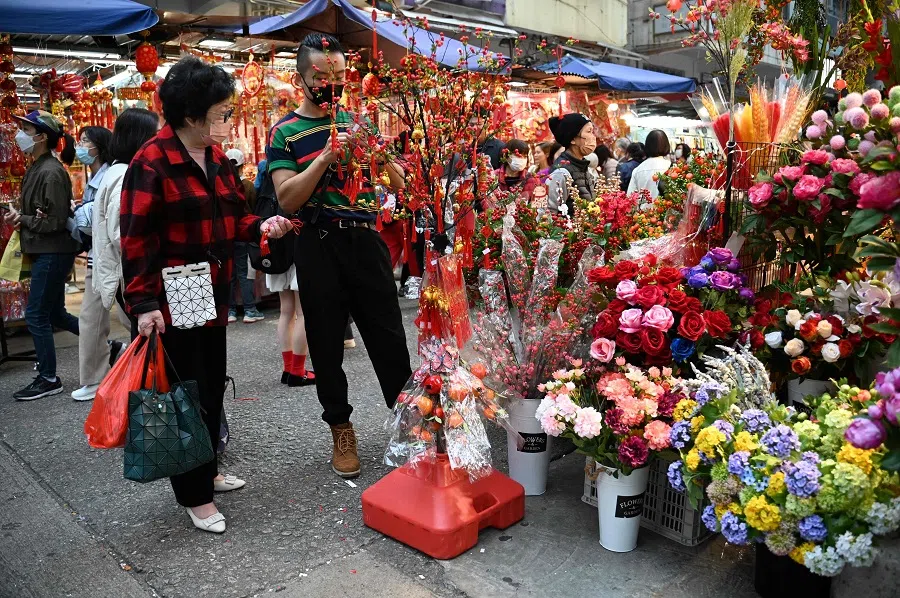 People shop at a market in Hong Kong on 6 February 2024. (Peter Parks/AFP)