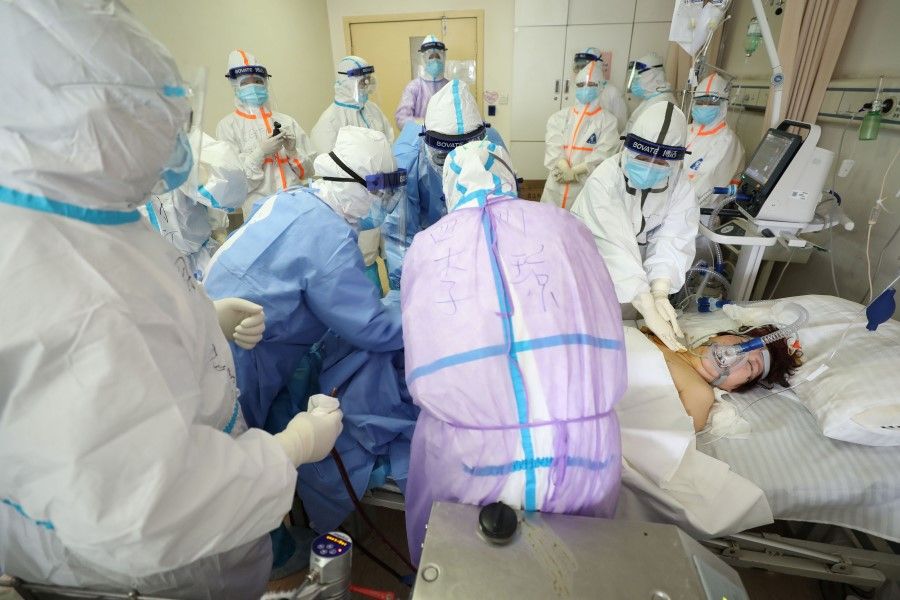 Medical staff treating a critical patient infected by the Covid-19 coronavirus at the Red Cross hospital in Wuhan. (AFP)