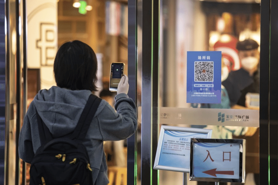 A QR code for Covid-19 contact tracing was displayed at the entrance of a shopping mall in Shanghai, China, on 29 November 2022. (Qilai Shen/Bloomberg)