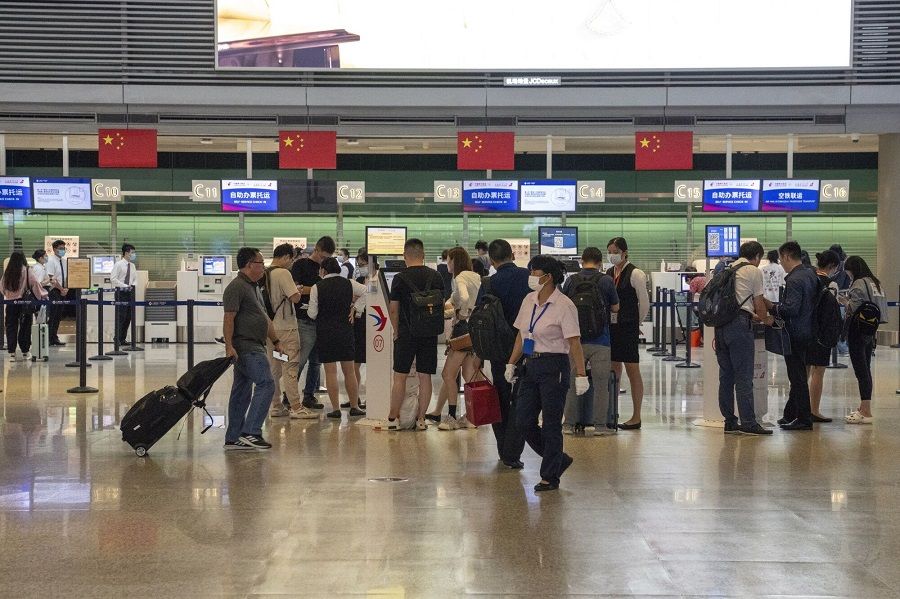 Travellers check in for flights at Hongqiao International Airport in Shanghai, China, on 27 September 2023, ahead of Golden Week. (Bloomberg)