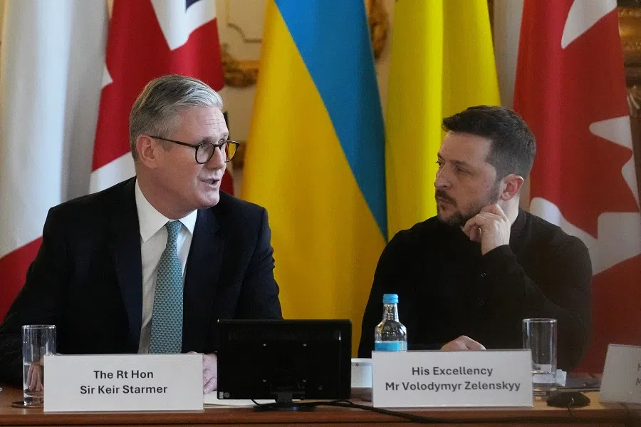 Ukraine’s President Volodymyr Zelenskyy, listens to British Prime Minister Keir Starmer as he speaks during a summit on Ukraine at Lancaster House in London, Britain, on 2 March 2025. (Christophe Ena/via Reuters)