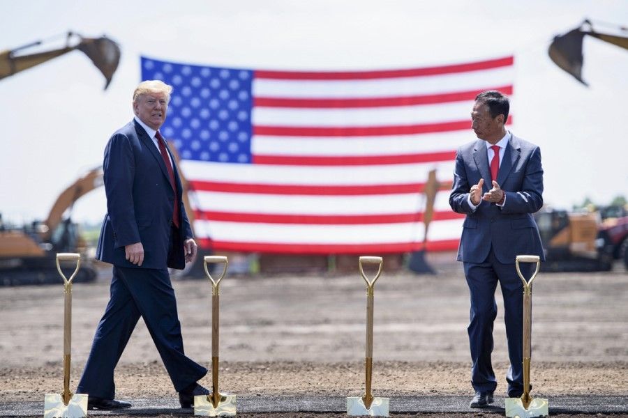 US President Donald Trump (left) and Foxconn Chairman Terry Gou arrive for a groundbreaking for a Foxconn facility at the Wisconsin Valley Science and Technology Park, 28 June 2018 in Mount Pleasant, Wisconsin. (Brendan Smialowski/AFP)