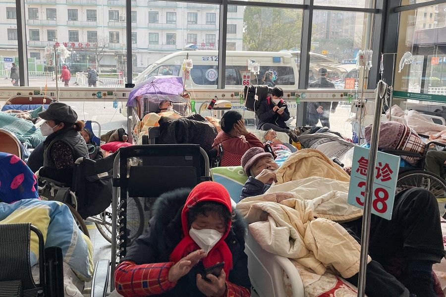 Patients lie on beds in the emergency department of a hospital, amid the Covid-19 outbreak in Shanghai, China, 5 January 2023. (Staff/Reuters)