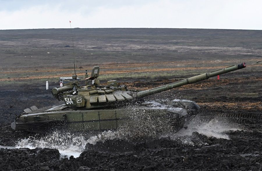 A Russian T-72B3 main battle tank drives during military drills at the Kadamovsky range in the Rostov region, Russia, 20 December 2021. (Sergey Pivovarov/Reuters)