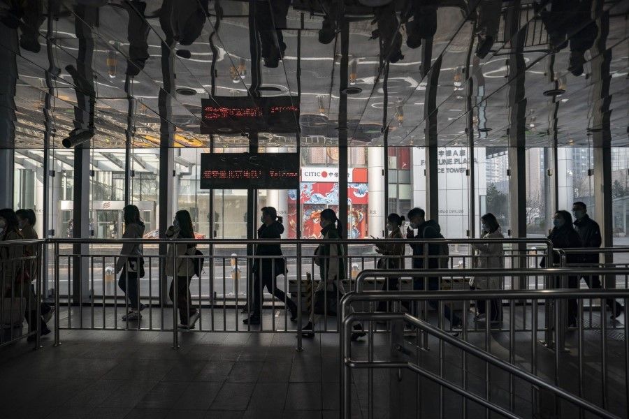 Commuters at a subway station in Beijing, China, on 6 March 2023. (Qilai Shen/Bloomberg)