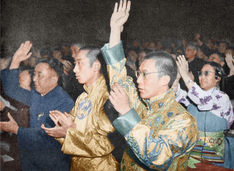 The Panchen Lama and Dalai Lama raising their hands in approval at a meeting of the Chinese People's Political Consultative Conference, December 1954.