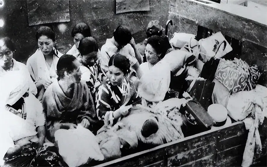 Women being transported in a military truck during World War II.