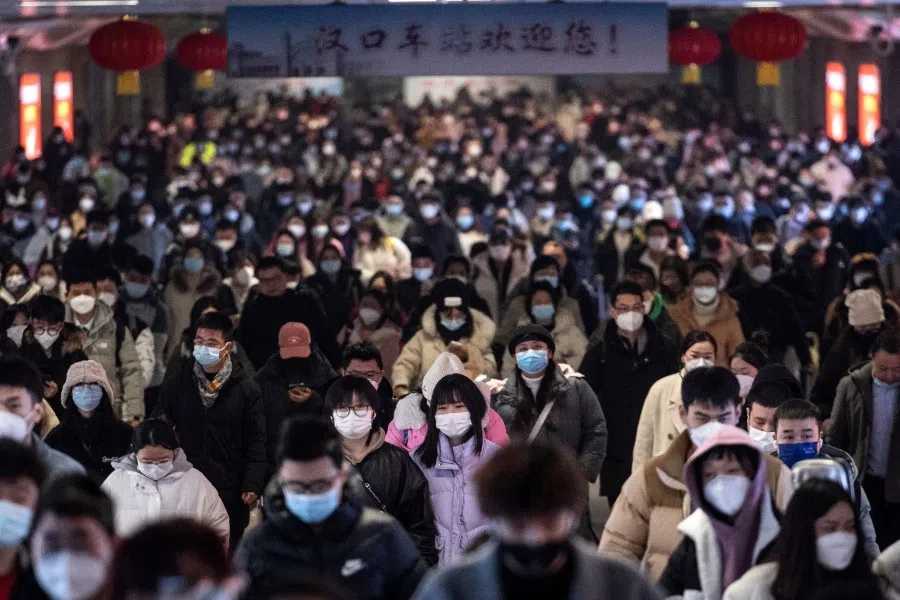 This photo taken on 27 January 2023 shows passengers arriving at Hankou railway station on the last day of the Lunar New Year holidays in Wuhan, in China's central Hubei province. (AFP)