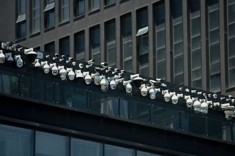 This file photo taken on 29 May 2019 shows Dahua surveillance cameras being installed on the Dahua Technologies office building in Hangzhou, in eastern China's Zhejiang province. Dahua Technology is a leading video surveillance equipment provider with an increasingly overseas footprint, with projects in Brazil, Italy, and other countries. (STR/AFP)