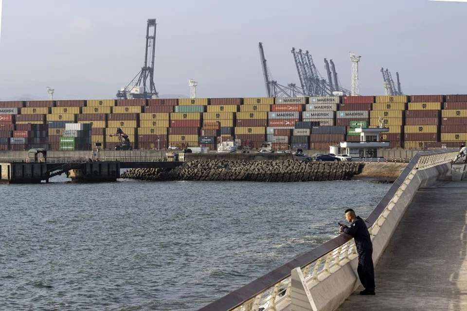 Shipping containers and gantry cranes at the Yantian International Container Terminals, operated by CK Hutchison Holdings Ltd.'s Hutchison Port Holdings Trust (HPH Trust), in Shenzhen, China, on 16 January 2024. (Shen Qilai/Bloomberg)