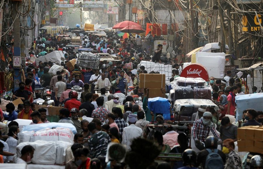 People walk at a crowded market amidst the spread of the Covid-19 coronavirus, in the old quarters of Delhi, India, 6 April 2021. (Anushree Fadnavis/File Photo/Reuters)